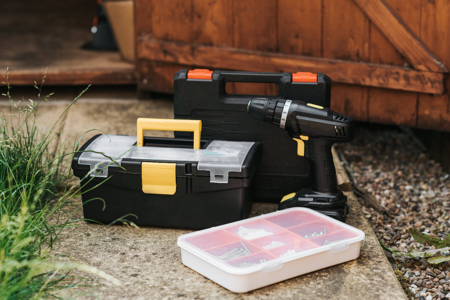 Toolboxes Placed Near a Wooden Garage Door